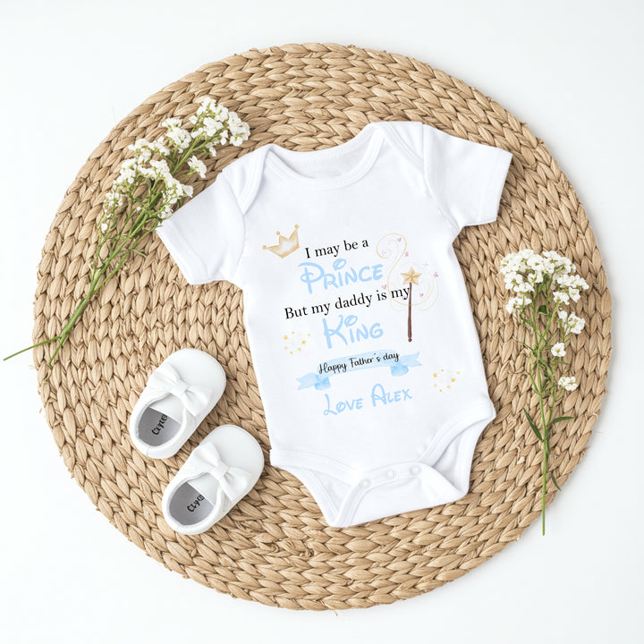 Personalised white Father's Day vest that says 'I may be a Prince But my daddy is my King Happy Father's Day Love Alex'. This design features a crown and a wand