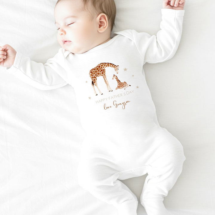 Personalised white Father's Day baby grow/sleepsuit that says 'Happy Father's Day Love Grayson'. This design features 2 giraffes surrounded by stars