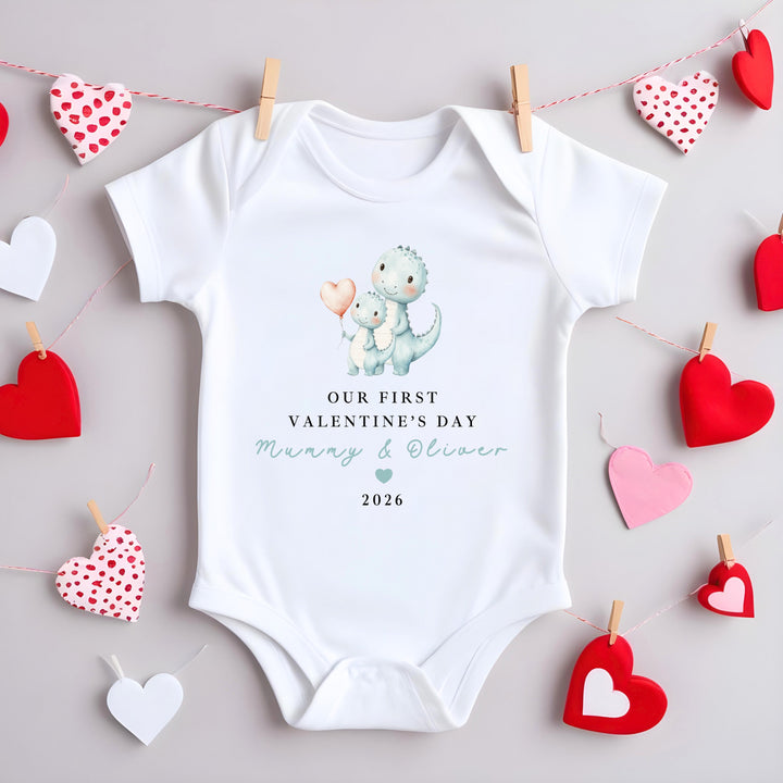 Personalised Blue Dinosaur Our First Valentines Day Baby Grow, Vest or Bib