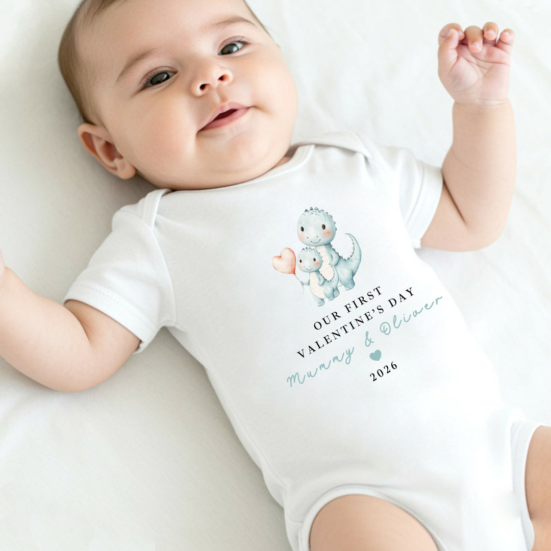 Personalised Blue Dinosaur Our First Valentines Day Baby Grow, Vest or Bib