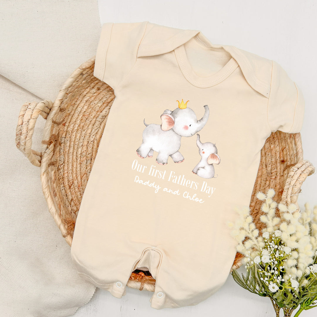 Personalised beige Father's Day baby romper that says 'Our First Fathers Day Daddy and Chloe'. This design features 2 elephants