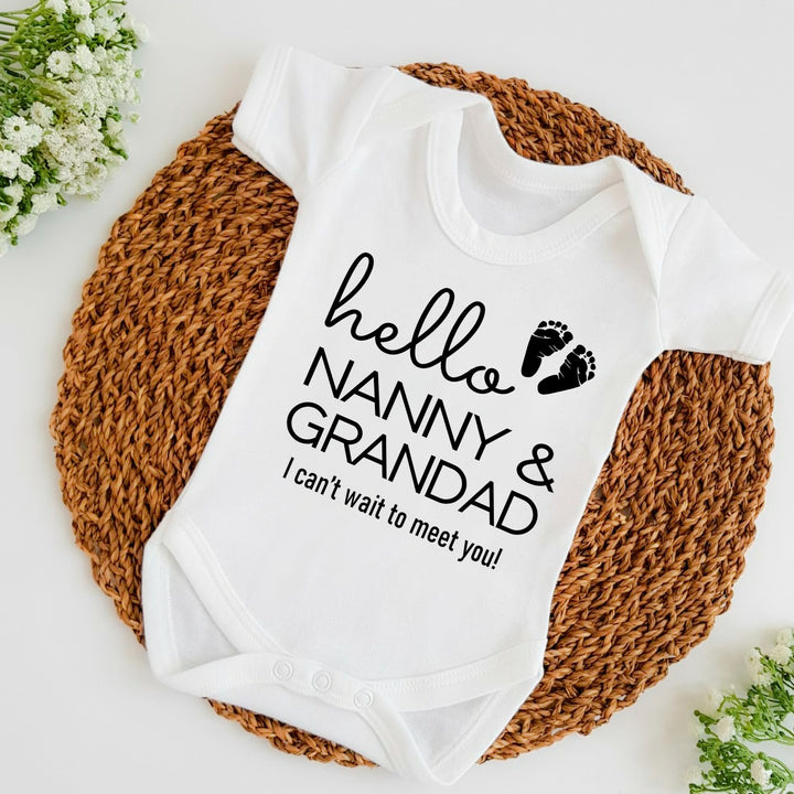 Baby announcement vests that says: Hello Nanny & Grandad I can't wait to meet you! With two baby feet 