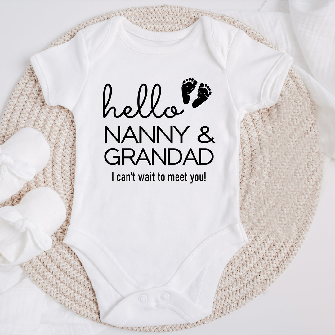 Baby announcement vests that says: Hello Nanny & Grandad I can't wait to meet you! With two baby feet 