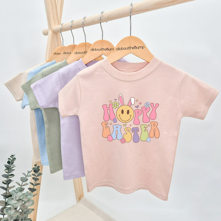 Baby pink retro style Easter t-shirt that says 'Hoppy Easter'