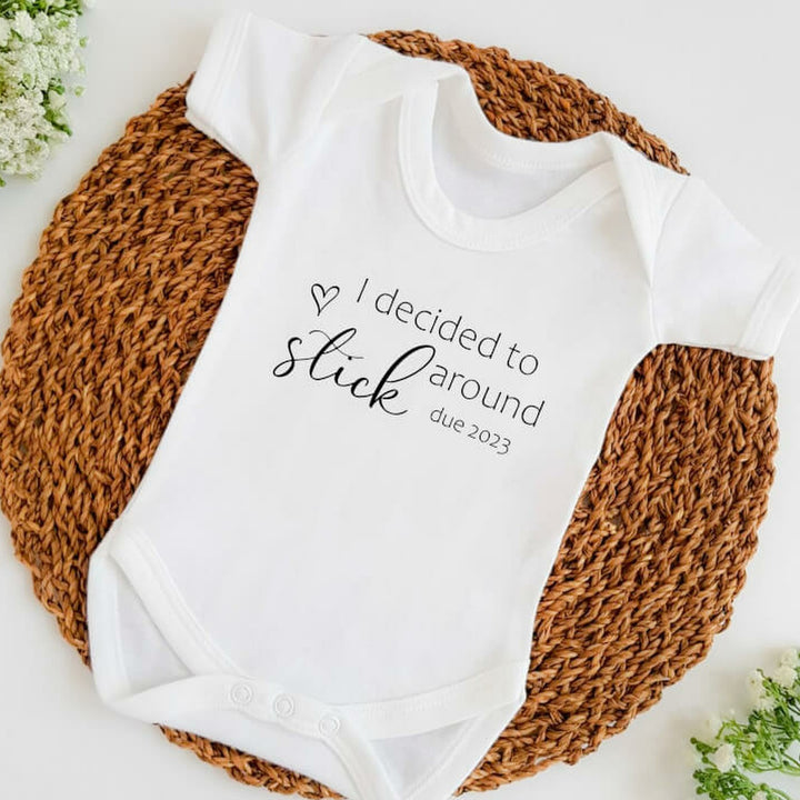 Baby announcement vests that says: I decided to stick around due 2023