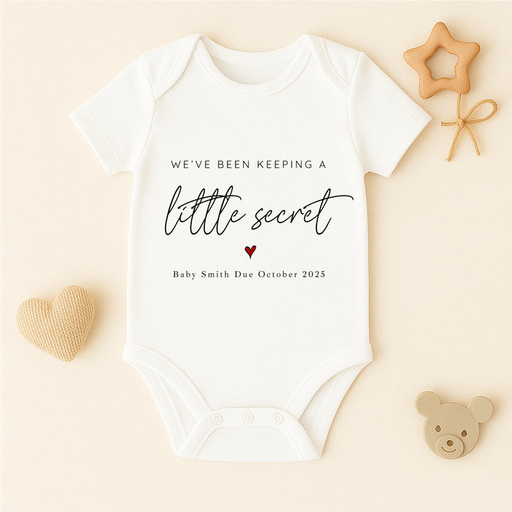 Personalised Keeping A Secret Baby Announcement Vest