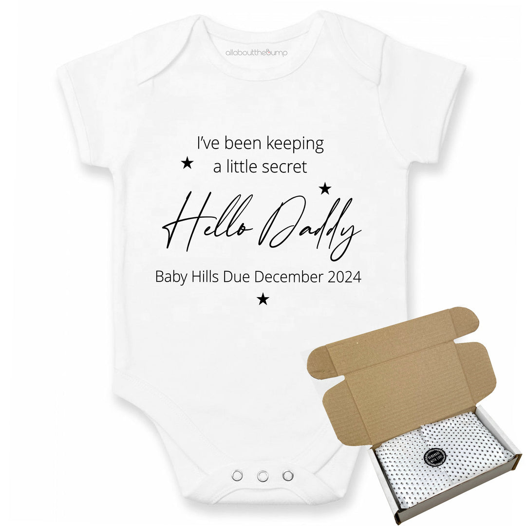 This baby announcement vest can be brought in a box lined with tissue paper