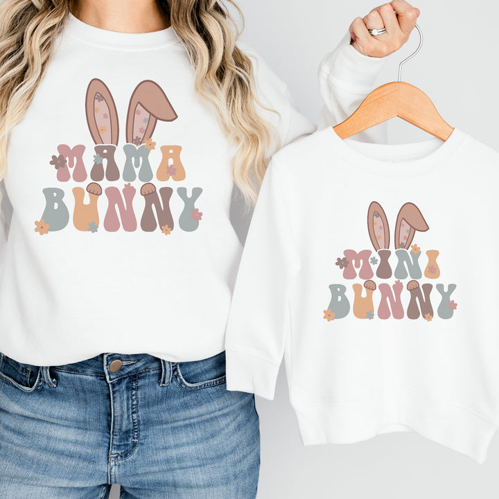 Adult white Easter sweatshirt that says 'Mama bunny' and a childs white Easter sweatshirt that says 'Mini Bunny'