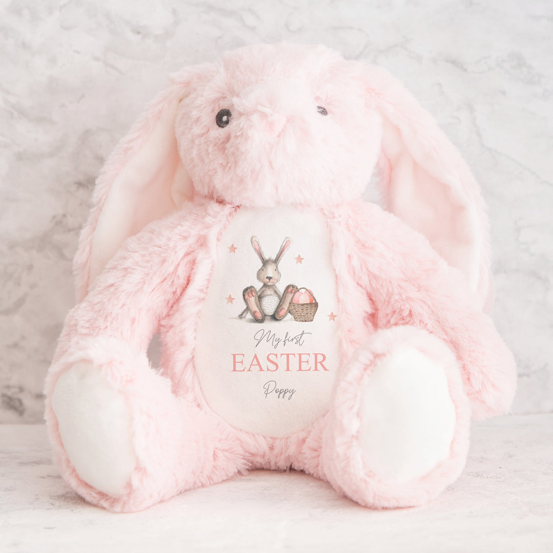 Personalised pink bunny Easter teddy that says 'My First Easter Poppy'. This design features a grey bunny holding a a pink Easter basket