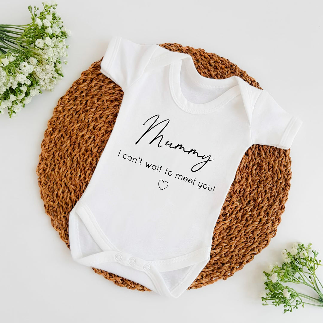 Baby announcement vests that says: Mummy I can't wait to meet you! With a small heart under