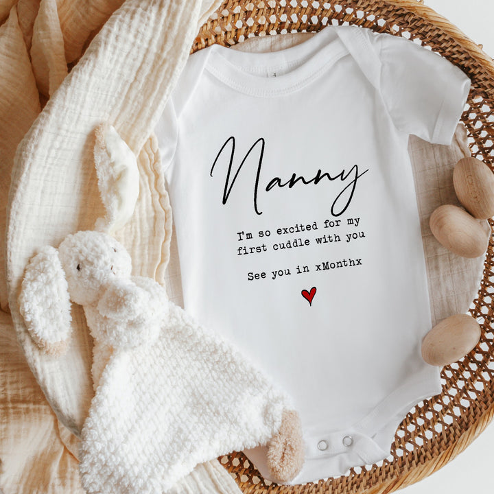 Baby announcement vests that says: Nanny I'm so excited for my first cuddle see you in Month 