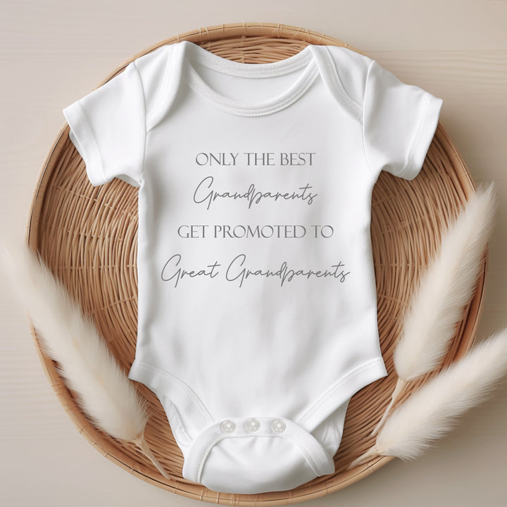 White baby vest with grey text saying: 'Only the best Grandparents get promoted to Great Grandparents'