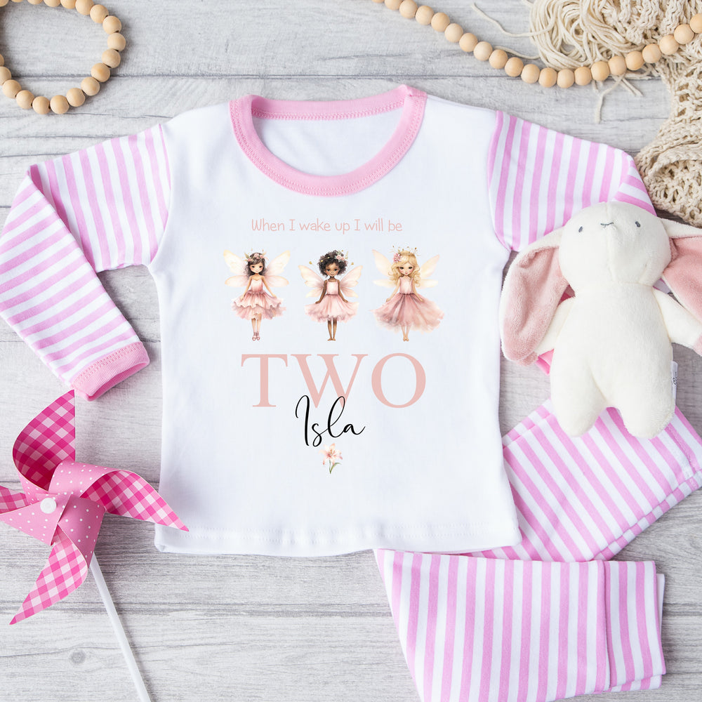 Personalised pink stripe birthday pyjamas that say 'When I wake up I will be TWO Isla'. This design features 3 princess faries