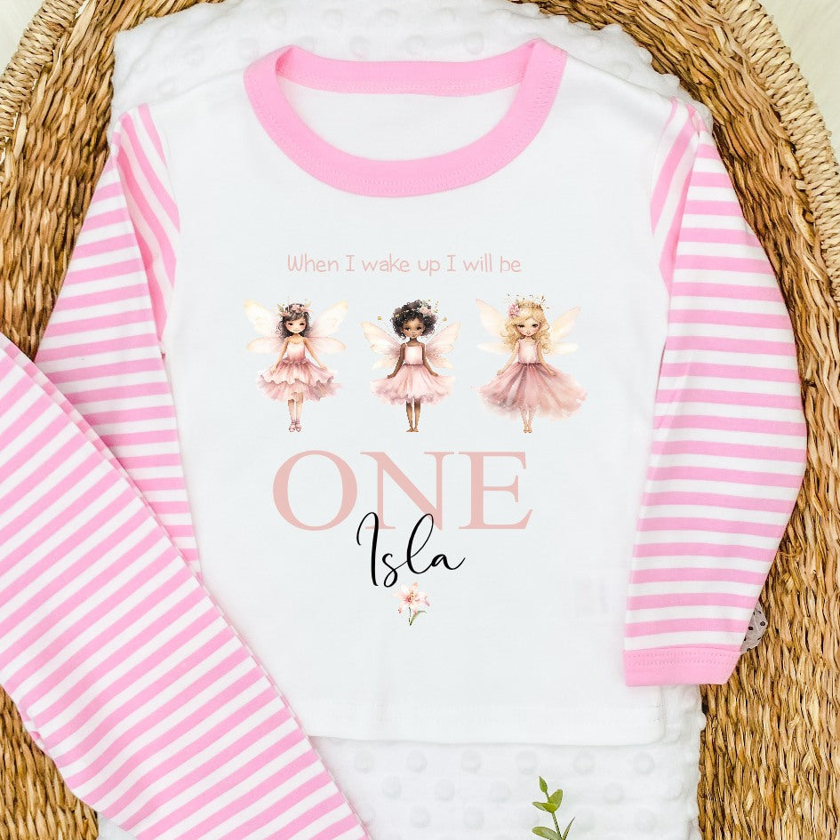 Personalised pink stripe birthday pyjamas that say 'When I wake up I will be ONE Isla'. This design features 3 princess faries