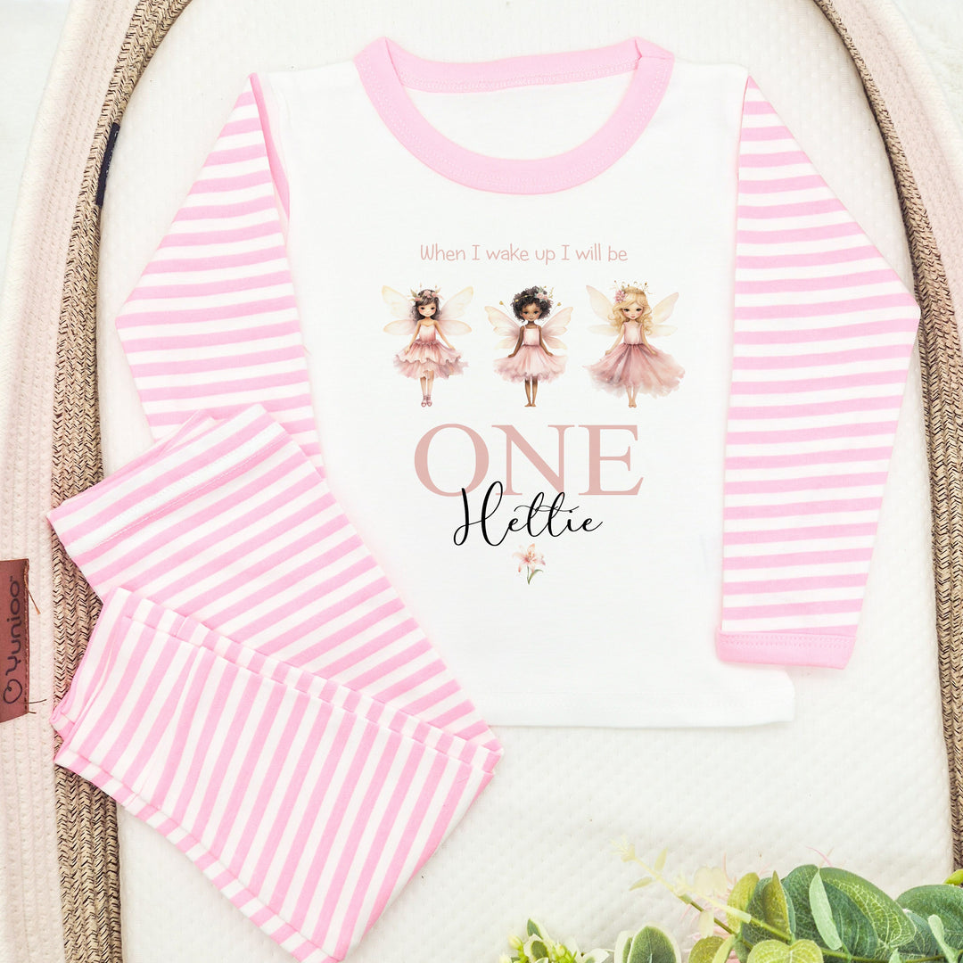 Personalised pink stripe birthday pyjamas that say 'When I wake up I will be ONE Hettie'. This design features 3 princess faries