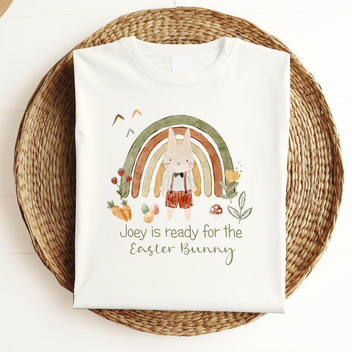 Personalised white Easter t-shirt that says 'Joey is ready for the Easter Bunny'. This design features a green rainbow with a rabbit standing in front of it