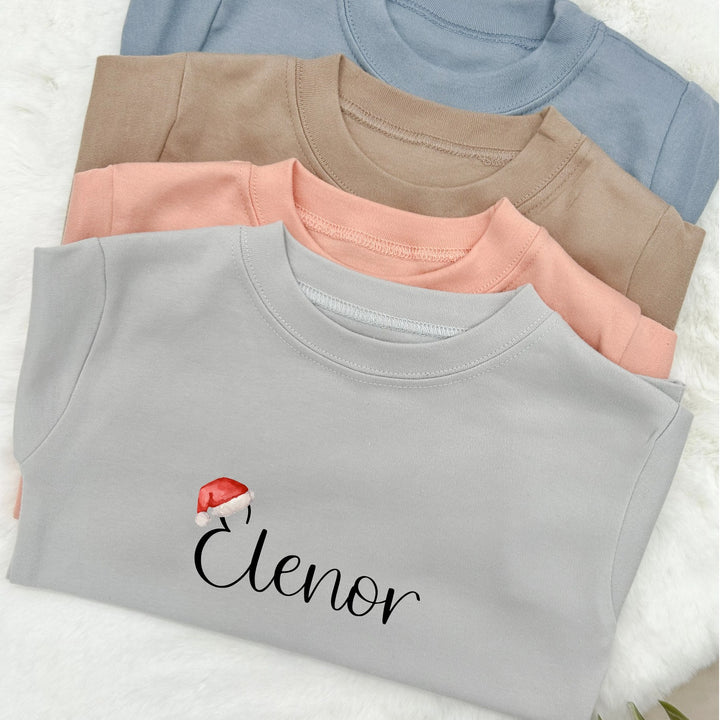 Santa Hat Name T-shirt | Peach Blue Brown Grey