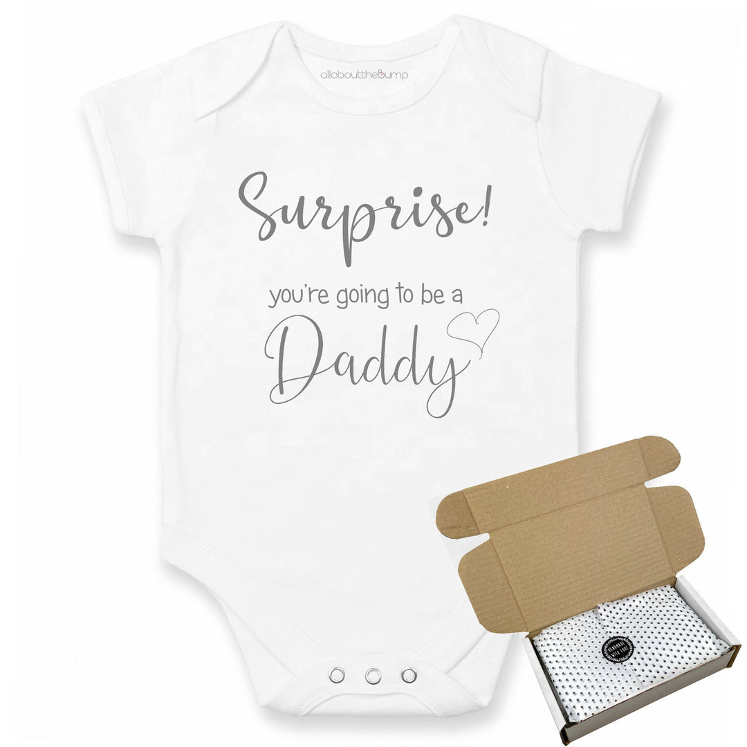 This baby announcement vest can be brought in a box lined with tissue paper