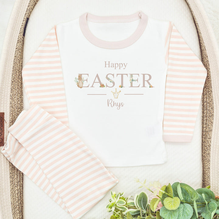 Personalised beige stripe Easter pyjamas that say 'Happy Easter Rhys'. This design features a rabbit wearing a beige jacket