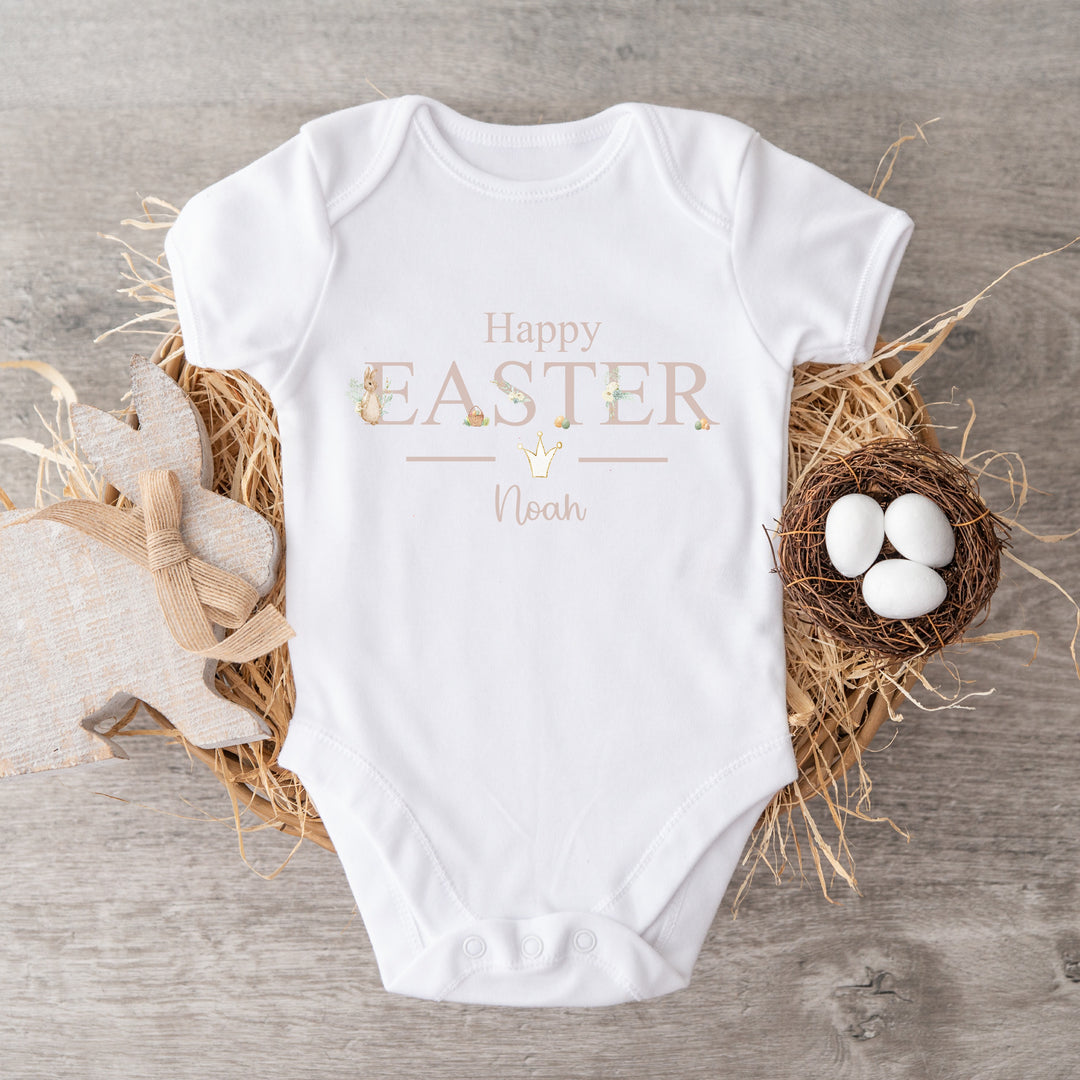 Personalised white Easter baby vest  that says 'Happy Easter Noah'. This design features a rabbit wearing a beige jacket