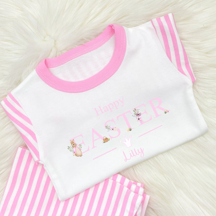 Personalised pink stripe Easter pyjamas that say 'Happy Easter Lilly'. This design features a rabbit wearing a pink jacket