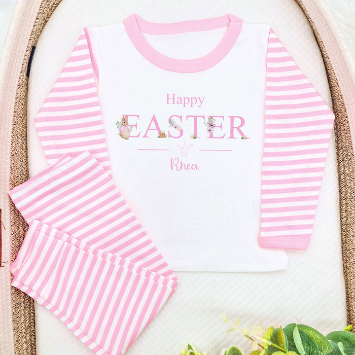 Personalised pink stripe Easter pyjamas that say 'Happy Easter Rhea'. This design features a rabbit wearing a pink jacket