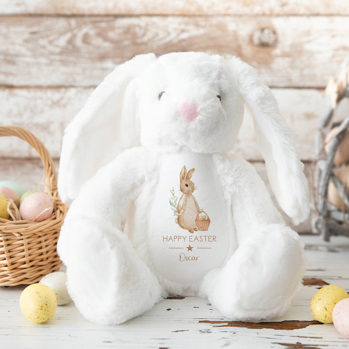 Personalised beige rabbit white teddy that says 'Happy Easter Oscar'. This design features a rabbit wearing a beige jacket holding an Easter basket