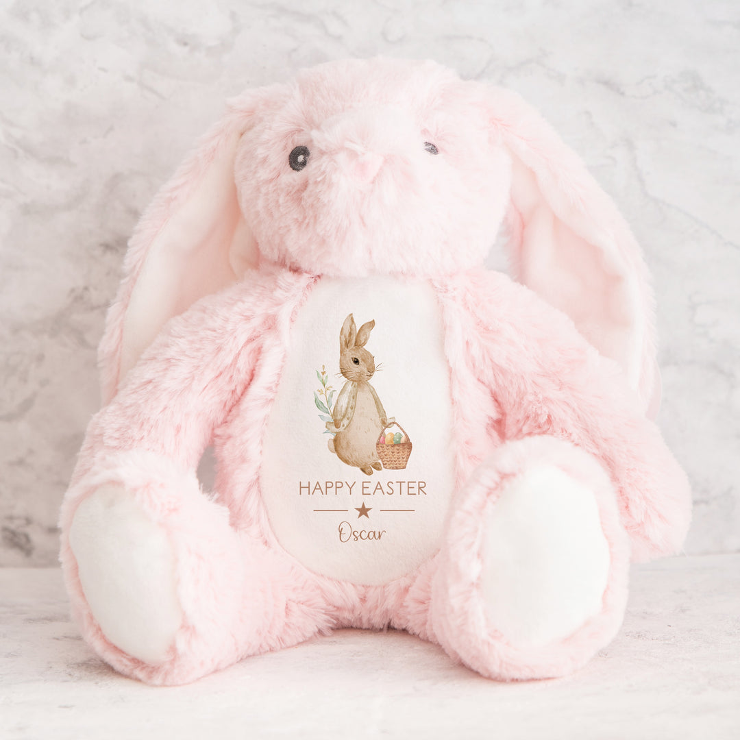 Personalised beige rabbit pink teddy that says 'Happy Easter Oscar'. This design features a rabbit wearing a beige jacket holding an Easter basket