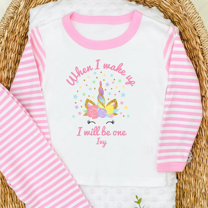 Personalised pink stripe birthday pyjamas saying 'When I wake up I will be one Ivy'. This desgin features a unicorn horn