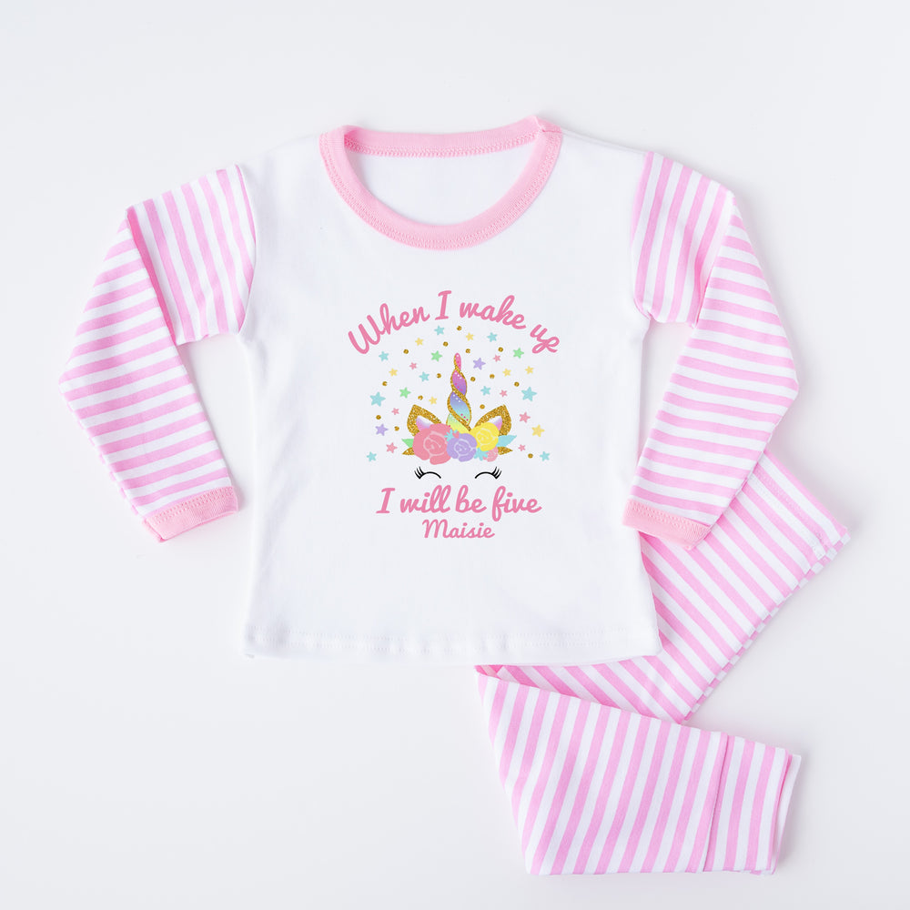 Personalised pink stripe birthday pyjamas saying 'When I wake up I will be five Maisie'. This desgin features a unicorn horn