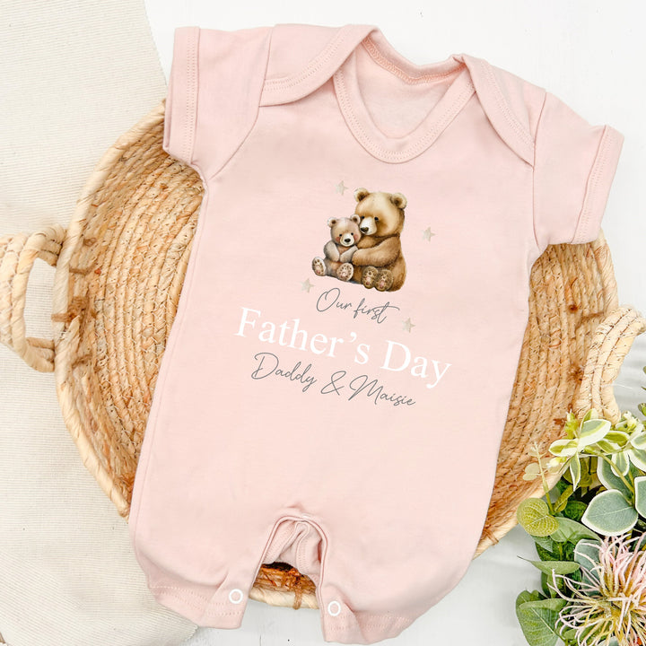 Personalised pink Father's Day baby romper that says 'Our first Father's Day Daddy & Maisie'. This design features a big brown bear and a baby brown bear