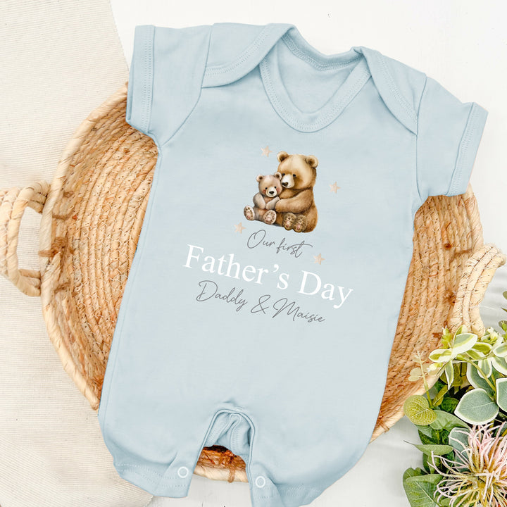 Personalised blue Father's Day baby romper that says 'Our first Father's Day Daddy & Maisie'. This design features a big brown bear and a baby brown bear