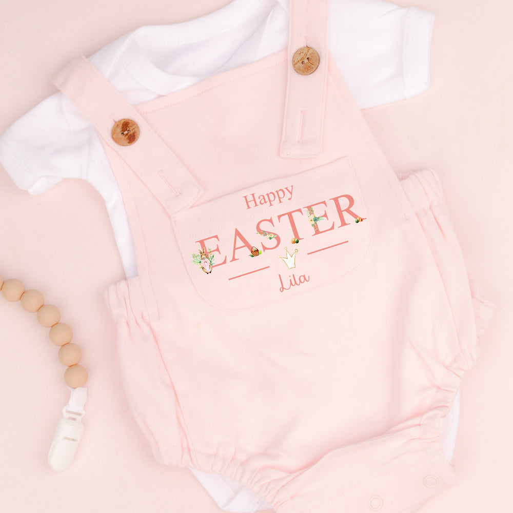 Personalised pink Easter dungarees that say 'Happy Easter Lila'. This design features a rabbit wearing a pink jacket